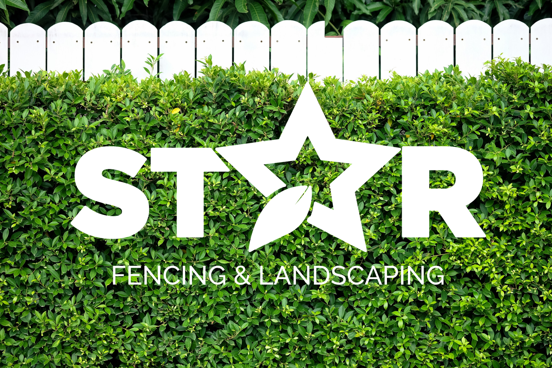 wooden fence with grass and logo