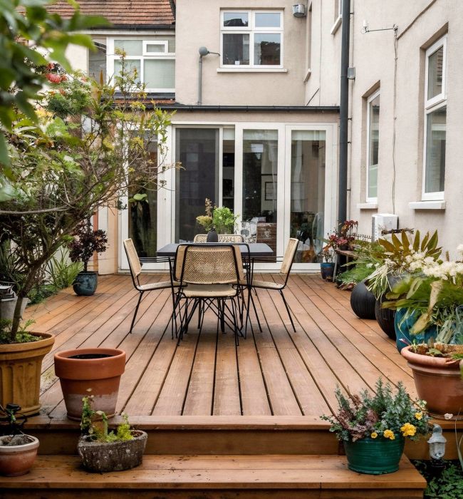 wooden decking attached to a white house