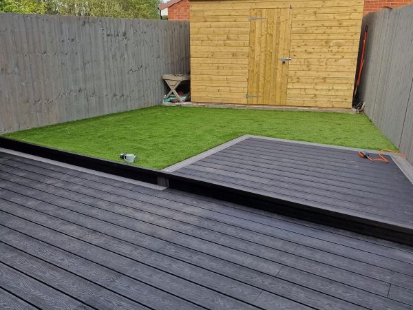 dark grey composite decking in a backyard